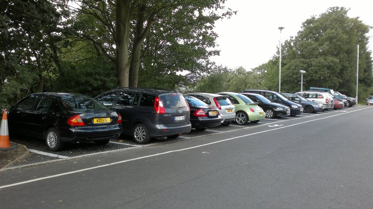 PERFO permeable parking bays for station car park. Natural drainage maintained and TPO / RPZ adhered to